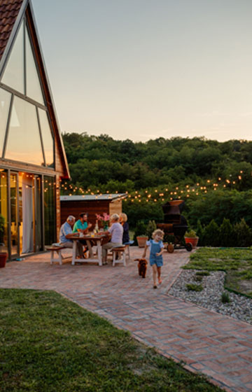 A Home with a Family Eating Outside Enjoying Food